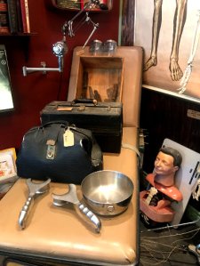 A patient's bed and doctor's tool at Bearded Lady Vintage & Oddities