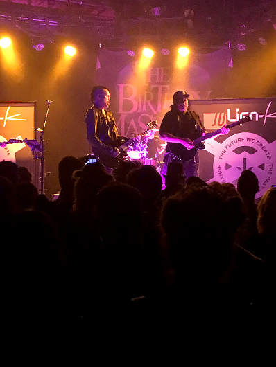 A shot of Ryan Shuck and Amir Derakh rocking out on stage