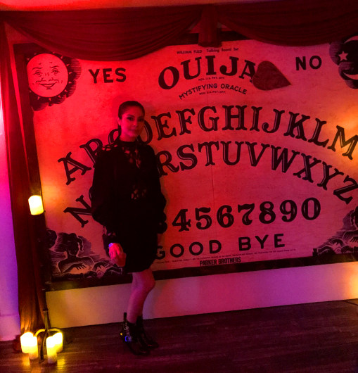 In front of the giant Ouija Board at House of Spirits: A Haunted Cocktail Soiree