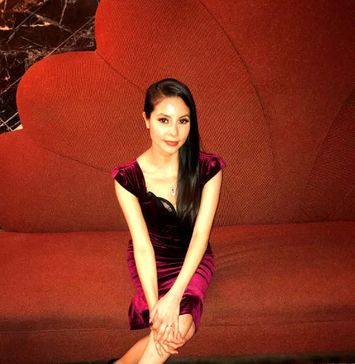 Vamp Jenn seated in the lobby