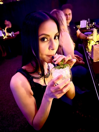 Vamp Jenn imbibing in a zero-proof cocktail