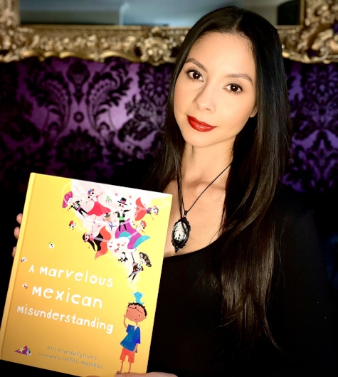 Woman holding a kid's picture book