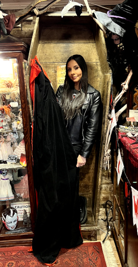 Vamp Jenn feeling at home in a coffin at Boutique du Vampyre