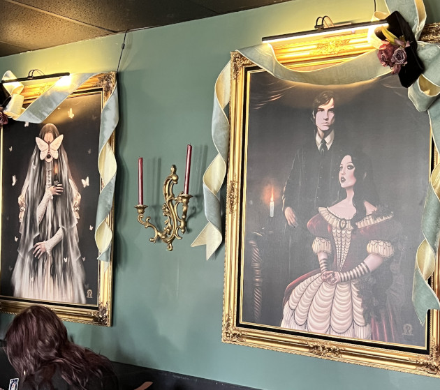 Portraits hanging in the tea room