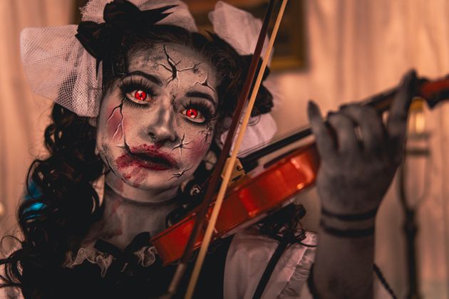 Spooky girl playing the violin (Photo credit: Israyosoy S. via Pexels)