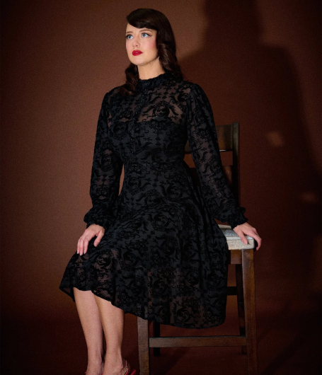 Annabelle x Unique Vintage 1970s Black Flocked Leota Swing Dress (Photo credit: Unique Vintage)